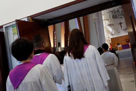 Catholics attend Mass at a church in Taipei, Taiwan March 11, 2018. REUTERS/Tyrone Siu