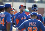 <p>Tim Tebow, center, takes a drink during a practice before his first instructional league baseball game for the New York Mets against the St. Louis Cardinals instructional club Wednesday, Sept. 28, 2016, in Port St. Lucie, Fla. (AP Photo/Luis M. Alvarez) </p>