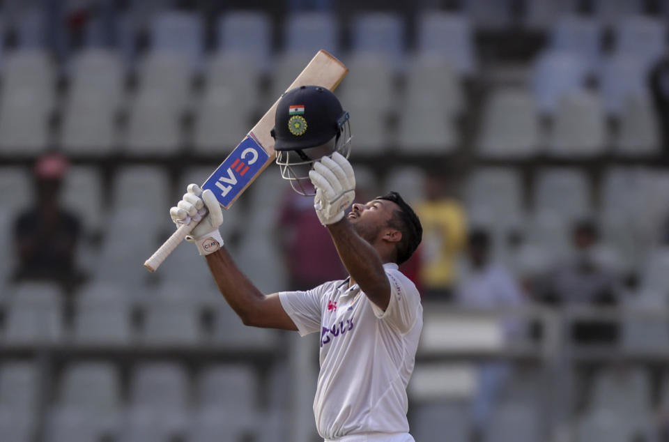 India's Mayank Agarwal celebrates scoring a century during the day one of second test cricket match against New Zealand in Mumbai, India, Friday, Dec. 3, 2021.(AP Photo/Rafiq Maqbool)