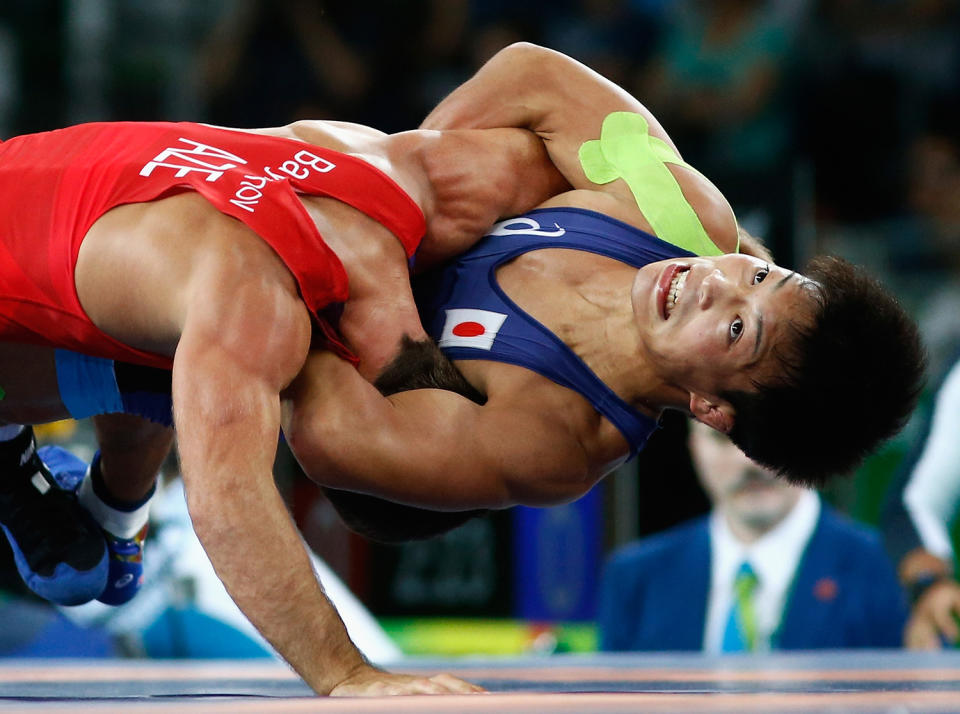 <p>Shinobu Ota of Japan competes against Rovshan Bayramov of Azerbaijan during the Men’s 59 kg Greco-Roman Wrestling semifinal on Day 9 of the Rio 2016 Olympic Games at the Carioca Arena 2 on August 15, 2016 in Rio de Janeiro, Brazil. (Photo by Phil Walter/Getty Images) </p>