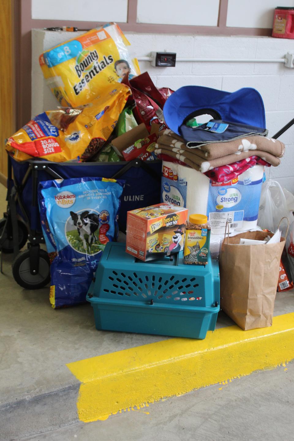 Donations were made to the animal shelter at the adoption event as well, including dog and cat food, treats, bedding, cleaning supplies and more.