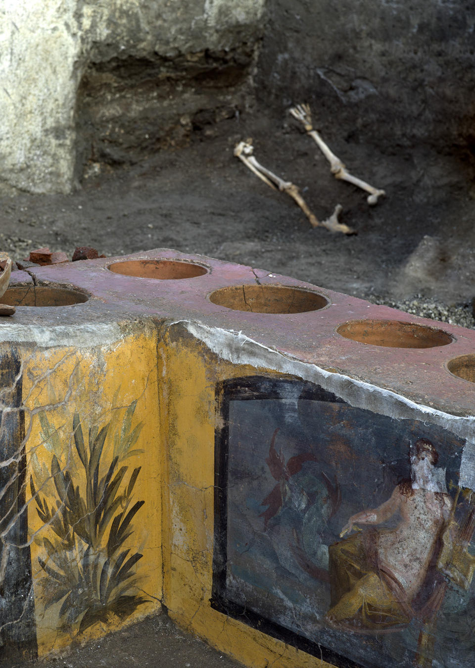 An undated photo made available by the Pompeii Archeological park press office shows the thermopolium in the Pompeii archeological park, near Naples, Italy. A fast-food eatery discovered at Pompeii is now completely excavated, helping to reveal some favorite dishes of citizens of the ancient Roman city who liked to eat out. Pompeii Archaeological Park’s longtime chief, Massimo Osanna said Saturday, Dec. 26, 2020, in a statement that while some 80 such fast-foods have been found at Pompeii, it is the first time such an eatery — known as a thermopolium since it serve hot foods — had been entirely excavated. (Luigi Spina/Parco Archeologico di Pompei via AP)