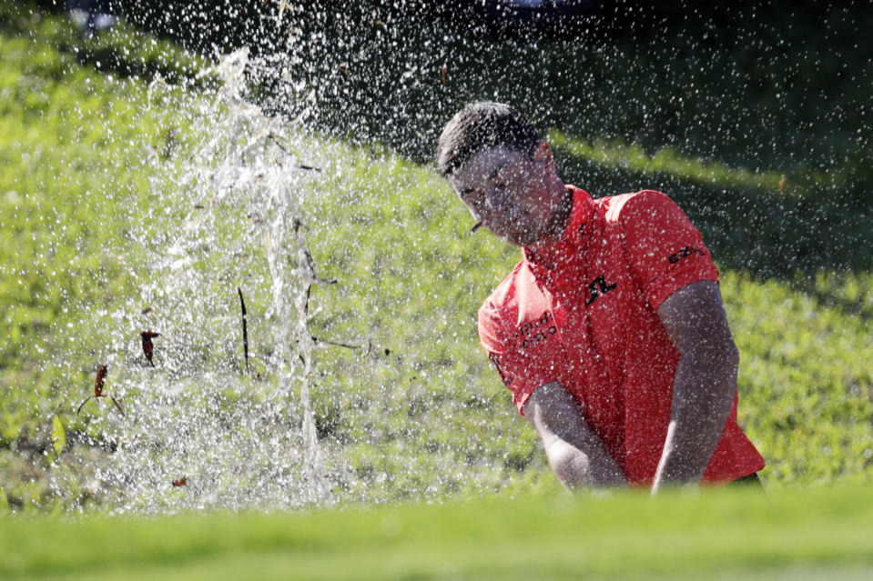 Viktor Hovland, of Norway, hits out of the water along the rough on the 12th hole during the second round of the Honda Classic golf tournament, Friday, Feb. 28, 2020, in Palm Beach Gardens, Fla. (AP Photo/Lynne Sladky)