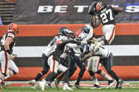 Cleveland Browns running back Kareem Hunt (27) rushes for a five-yard touchdown during the second half of an NFL football game against the Philadelphia Eagles, Sunday, Nov. 22, 2020, in Cleveland. (AP Photo/David Richard)