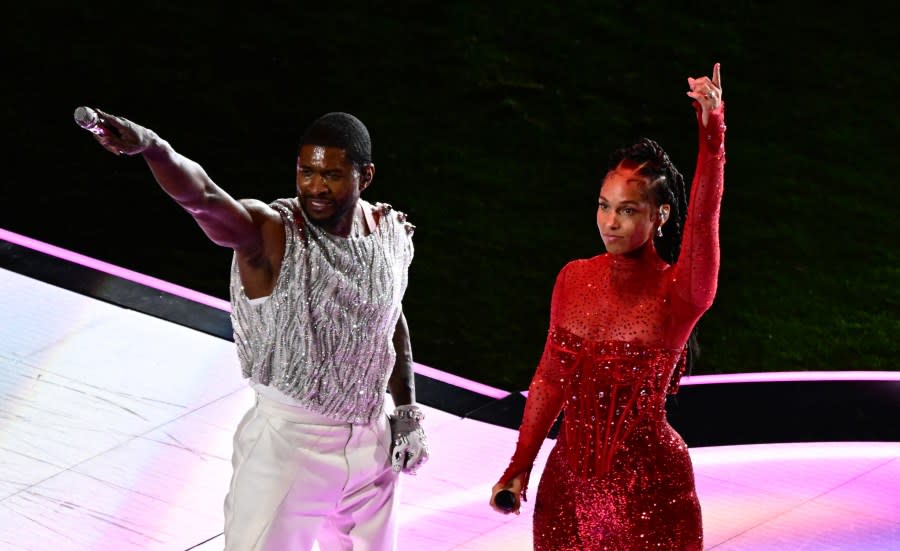 US singer-songwriter Usher (L) and US singer-songwriter Alicia Keys perform during Apple Music halftime show of Super Bowl LVIII between the Kansas City Chiefs and the San Francisco 49ers at Allegiant Stadium in Las Vegas, Nevada, February 11, 2024. (Photo by Patrick T. Fallon / AFP) (Photo by PATRICK T. FALLON/AFP via Getty Images)