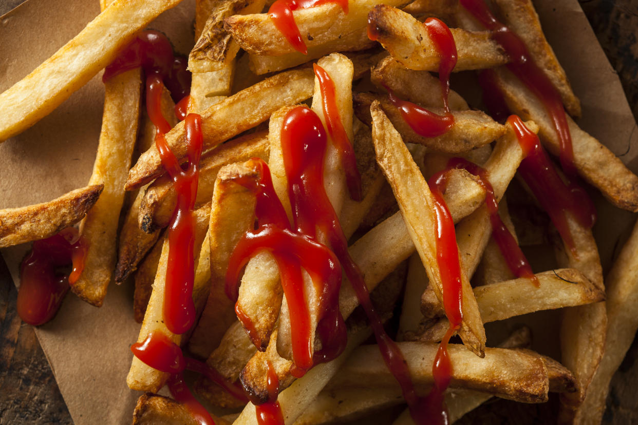 Homemade French Fries Covered in Tomato Ketchup