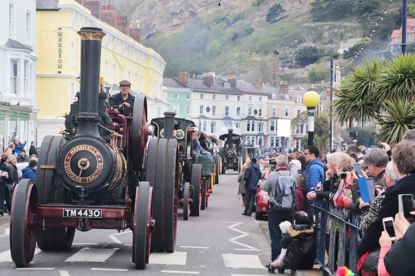 Parade of vintage steam traction engines at the festival