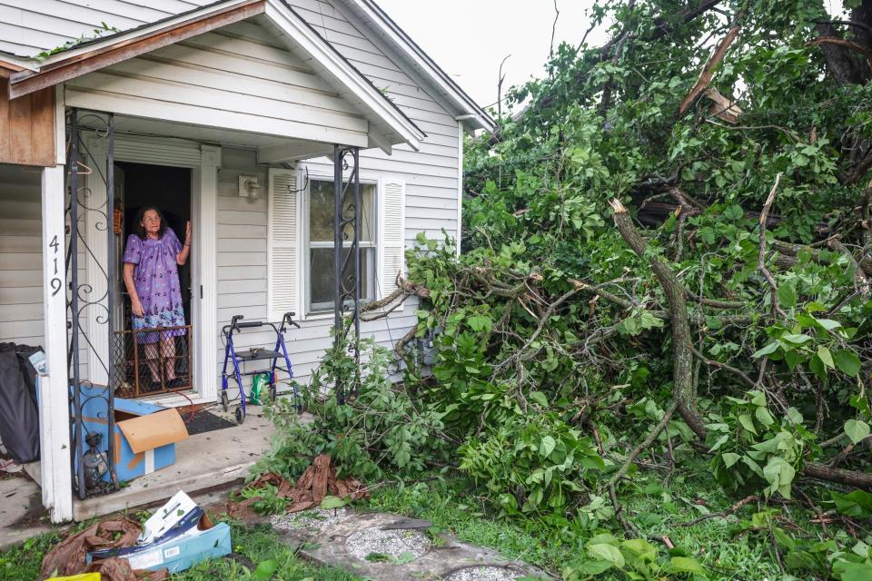 Connie Buckingham views storm damage from the front door of her son's home, where she also lives, Sunday, May 26, 2024, in Claremore, Okla (AP)