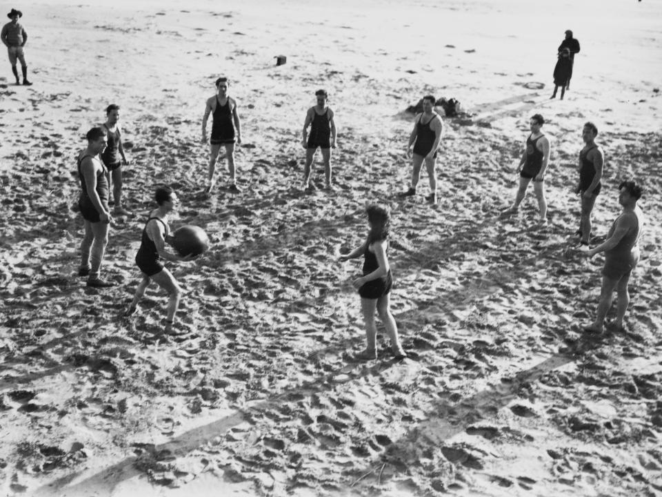 Beachgoers playing ball games at Coney Island in 1923.