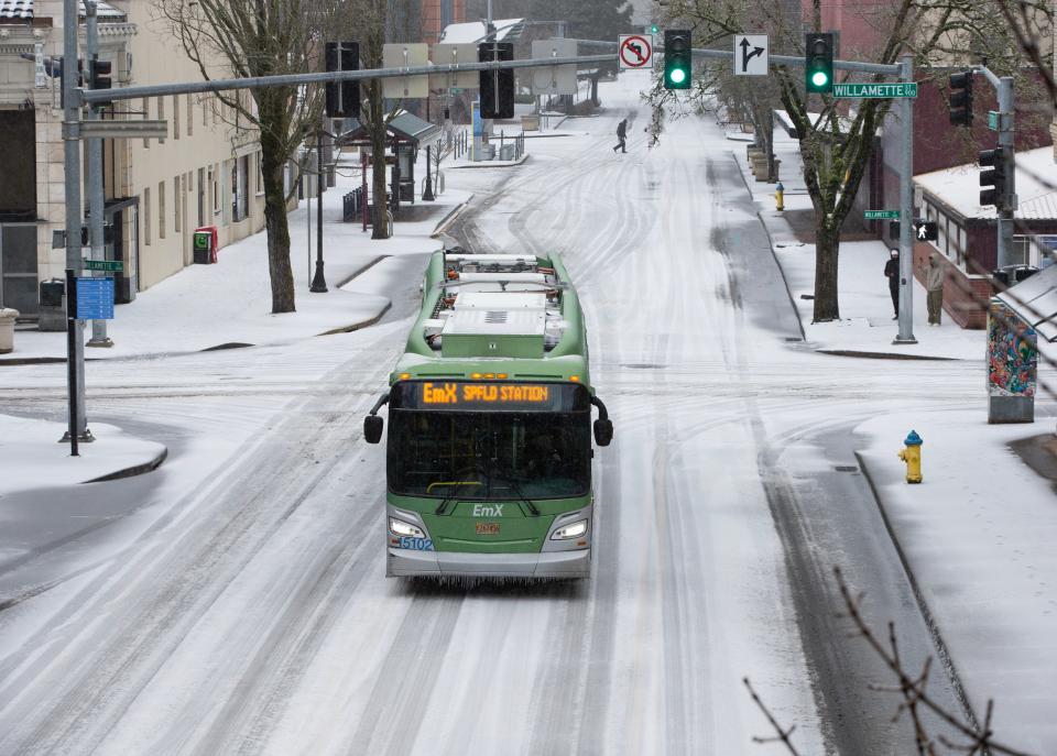 An Ltd Bus Moves Slowly Down W. 10Th Avenue In Downtown Eugene As A Cold Weather Front Moves Through The Willamette Valley Saturday, Jan. 13, 2024.