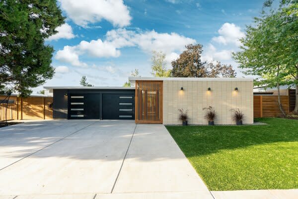 Located just 15 minutes from Downtown Portland, the historic home offers a convenient city escape. The landscaped exterior is a slice of low-maintenance paradise, presenting a lush turf lawn and an expansive concrete driveway.