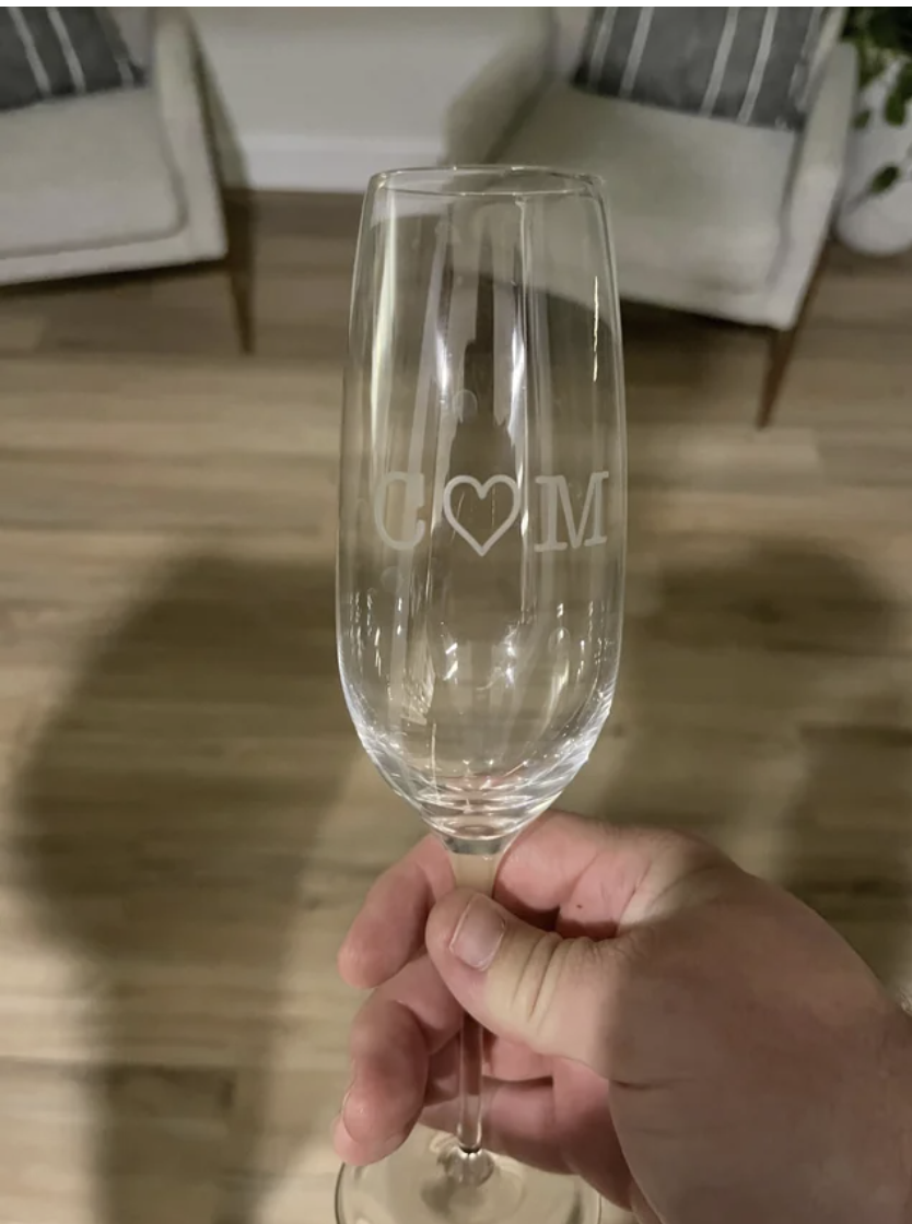 Someone holding up a wine glass