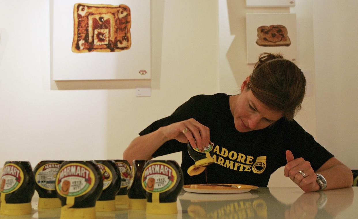 Henrietta Birchenough squeezes a tube of Marmite onto a piece of toast. Photo: Scott Barbour/Getty Images