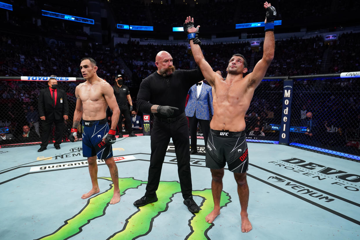 HOUSTON, TEXAS - MAY 15: (R-L) Beneil Dariush reacts after defeating Tony Ferguson in their lightweight bout during the UFC 262 event at Toyota Center on May 15, 2021 in Houston, Texas. (Photo by Josh Hedges/Zuffa LLC)