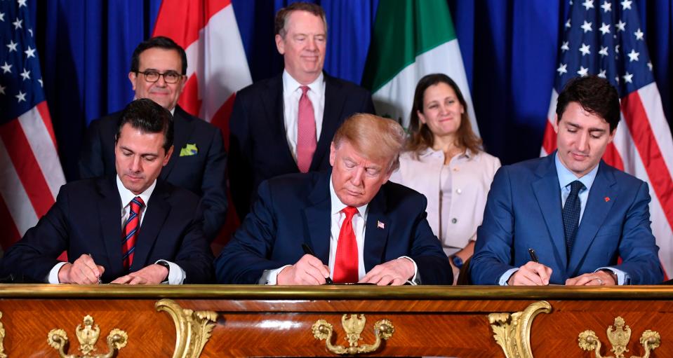 Mexico's President Enrique Pena Nieto, President Donald Trump and Canadian Prime Minister Justin Trudeau, sign a new free trade agreement in Buenos Aires, on November 30, 2018, on the sidelines of the G20 Leaders' Summit.