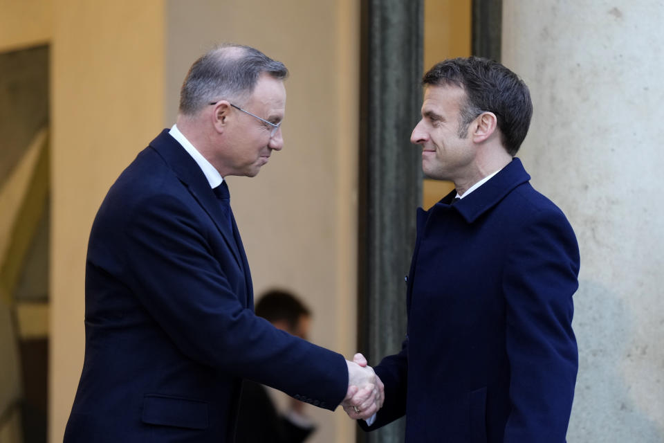 French President Emmanuel Macron, right, welcomes Poland's President Andrzej Duda at the Elysee Palace in Paris, Monday, Feb. 26, 2024. More than 20 European heads of state and government and other Western officials are gathering in a show of unity for Ukraine, signaling to Russia that their support for Kyiv isn't wavering as the full-scale invasion grinds into a third year. (AP Photo/Lewis Joly)