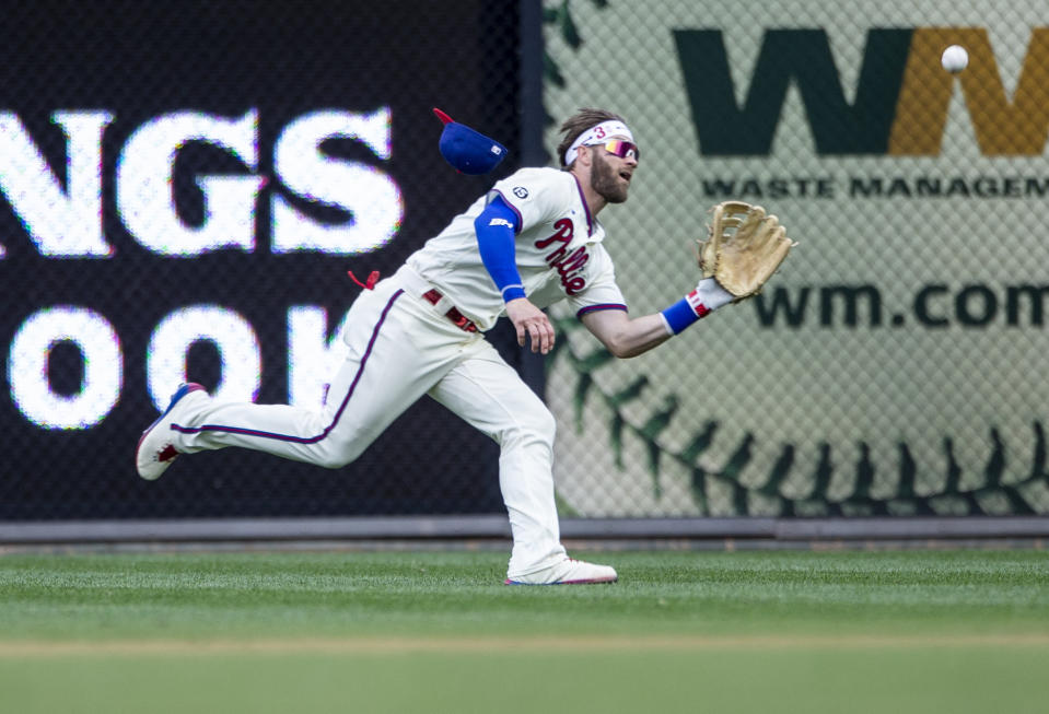 Philadelphia Phillies right fielder Bryce Harper (3) catches a fly ball hit by New York Yankees' Gio Urshela during the sixth inning of a baseball game, Saturday, June 12, 2021, in Philadelphia. (AP Photo/Laurence Kesterson)