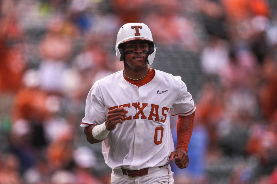 Texas infielder Trey Faltine (0) runs towards home during the game against Kansas at Disch-Falk Field in Austin, Texas on May 21, 2022.
