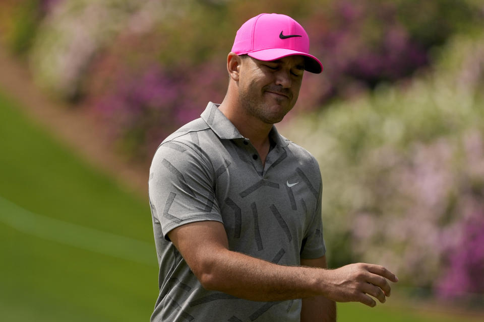 Brooks Koepka reacts after a missed birdie putt on the sixth hole during the first round of the Masters golf tournament on Thursday, April 8, 2021, in Augusta, Ga. (AP Photo/Charlie Riedel)