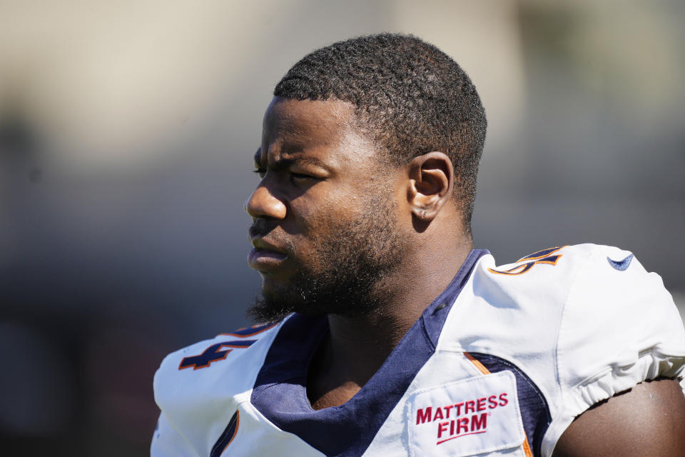 Denver Broncos outside linebacker Aaron Patrick takes part in drills during the NFL football team's training camp Tuesday, Aug. 2, 2022, at the Broncos' headquarters in Centennial, Colo. (AP Photo/David Zalubowski)