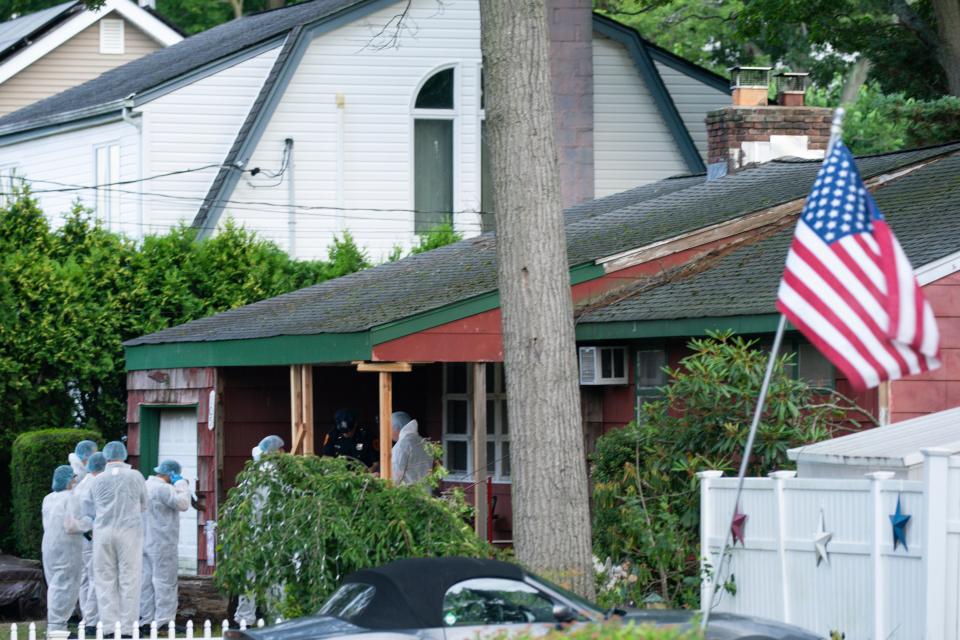 Crime laboratory officers arrive to the house where a suspect has been taken into custody on New York's Long Island in connection with a long-unsolved string of killings, known as the Gilgo Beach murders, Friday, July 14, 2023, in Massapequa, N.Y.