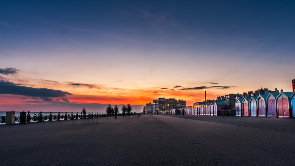 The beautiful beach huts at Hove are the perfect backdrop for a sundowner. (Getty Images)