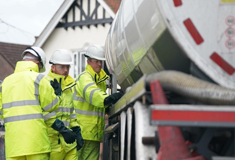 Members of the armed forces work on a fuel tanker at a garage in Waltham Abbey, Essex (PA) (PA Wire)