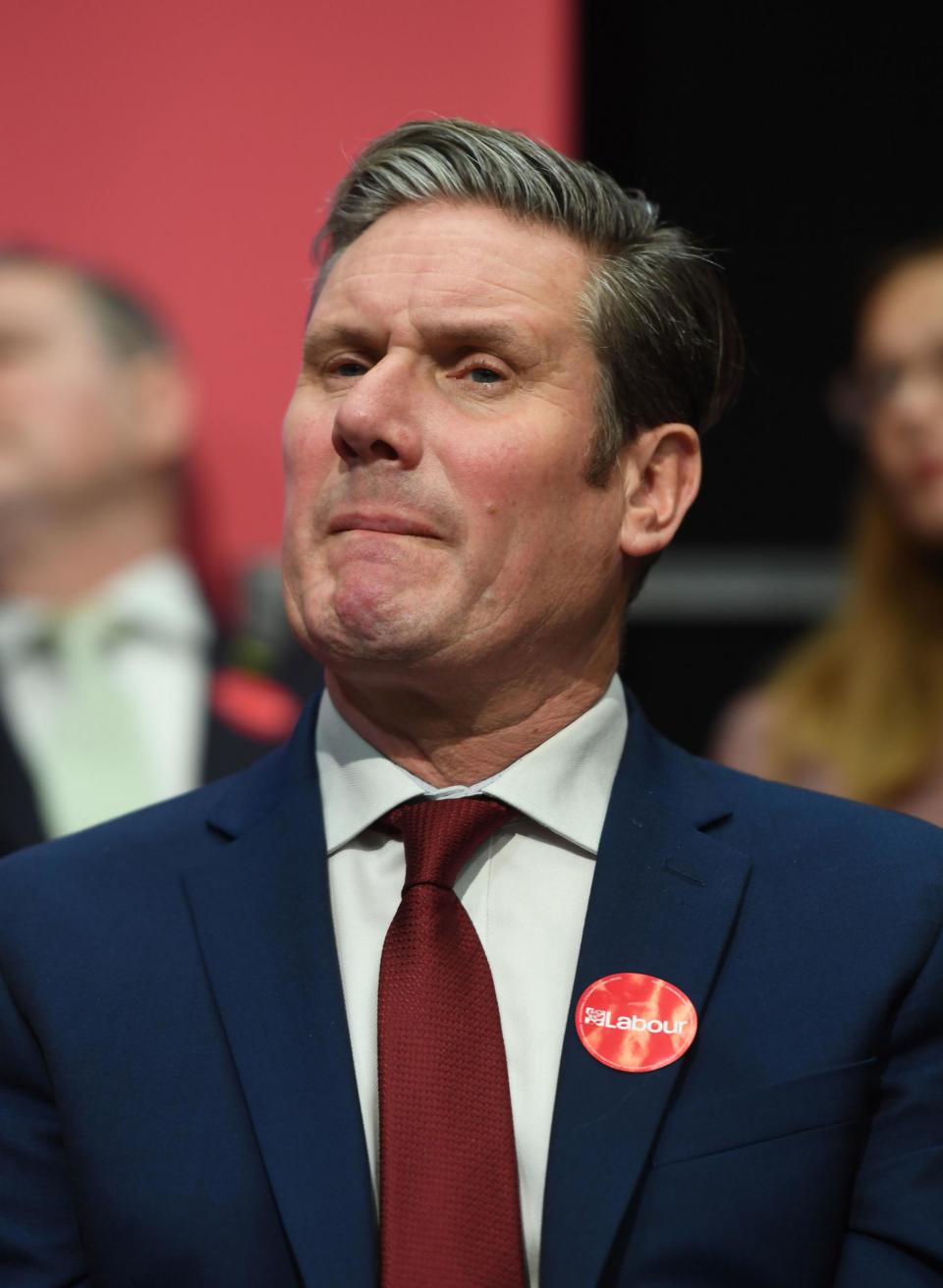 Keir Starmer listens to Labour Party leader Jeremy Corbyn speaking during the launch of his party's manifesto in Birmingham on Thursday (PA)