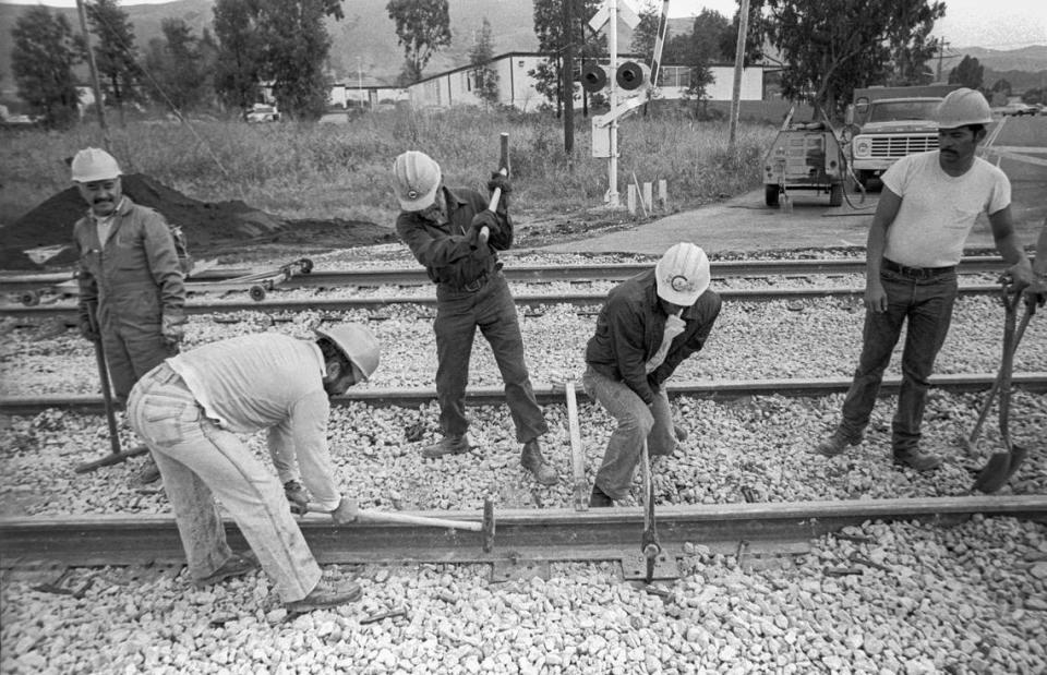 Southern Pacific workers swing spike mauls while repairing track in San LUis Obispo on March 12, 1984.