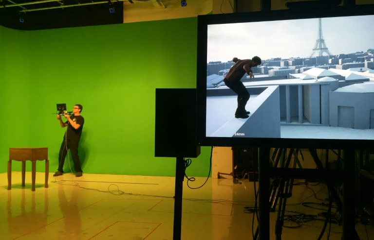 A camera technician works with CBS Digital's state-of-the-art "Parallax' and "Previz" production systems in a green room at CBS Digital in Los Angeles on November 16, 2016