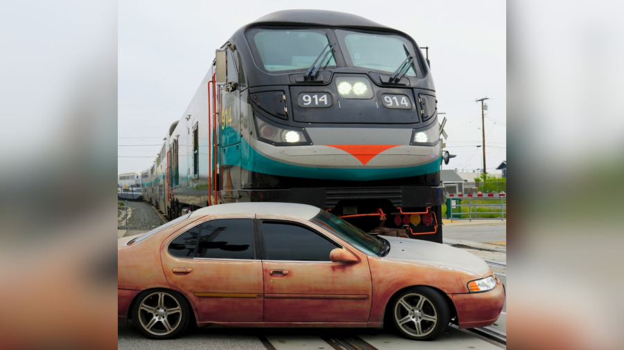 A driver was uninjured after nearly being crushed by a Metrolink train in San Bernardino.