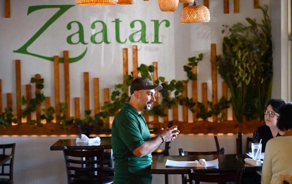 Roy Nassar chats to customers on their first visit to Zaatar Bistro, Wednesday, April 10, 2024 in Fresno.