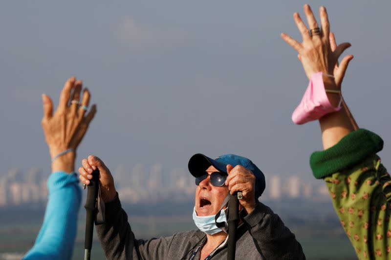 To lift lockdown gloom, Israelis keep calm and carry on screaming