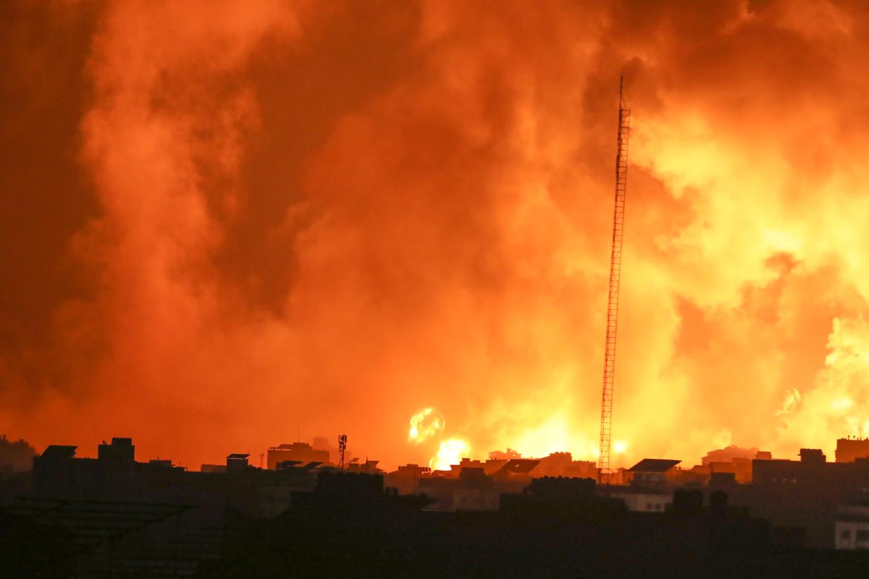 Fire and smoke rises from buildings following Israeli airstrikes on Gaza City (Copyright 2023 The Associated Press. All rights reserved.)