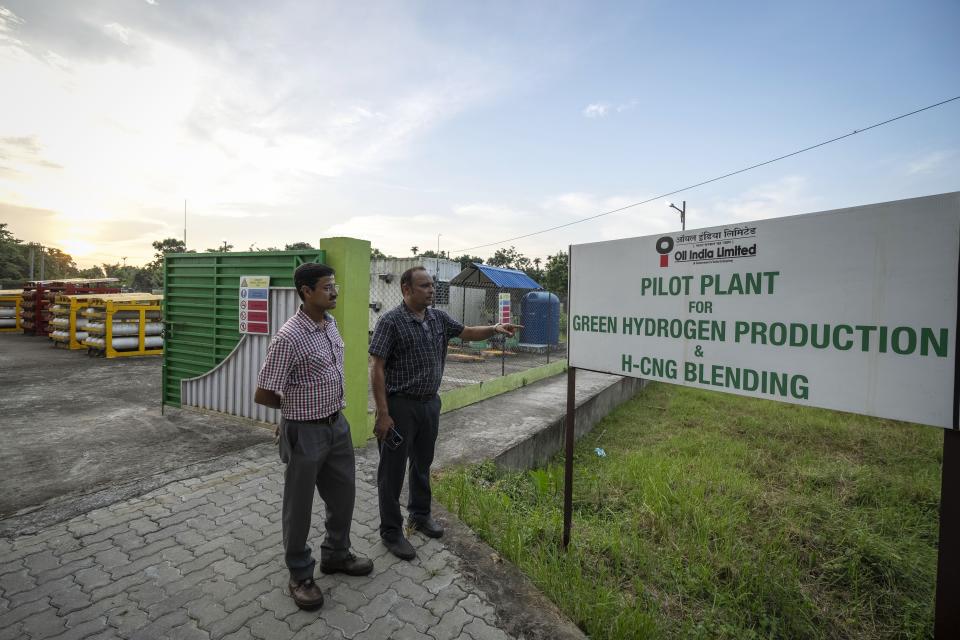 P V R Murthy, general manager at Oil India Limited, points out a sign at the plant in Jorhat, India, Thursday, Aug. 17, 2023. Green hydrogen is being touted around the world as a clean energy solution to take the carbon out of high-emitting sectors like transport and industrial manufacturing. (AP Photo/Anupam Nath)