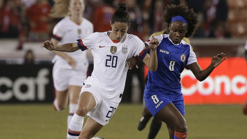 Etienne (right) competes with the USWNT's Christen Press for the ball during an Olympic qualifying match in January 2020. - Bob Levey/Getty Images