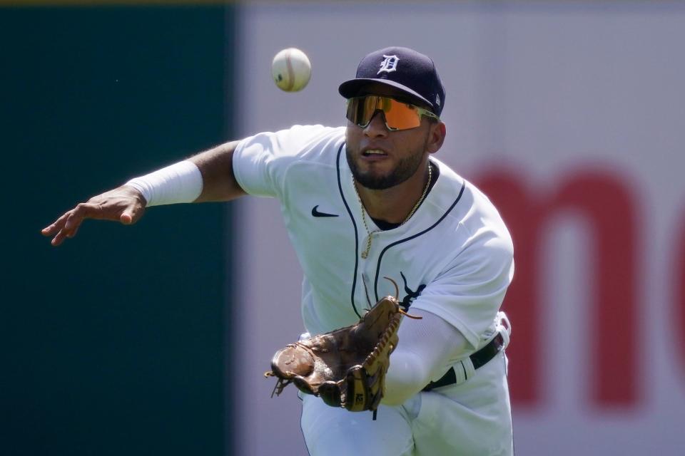 Detroit Tigers right fielder Victor Reyes misplays the single by Toronto Blue Jays' Teoscar Hernandez but is able to recover and throw out Vladimir Guerrero Jr. at second on a fielder's choice during the first inning of a baseball game, Sunday, Aug. 29, 2021, in Detroit.