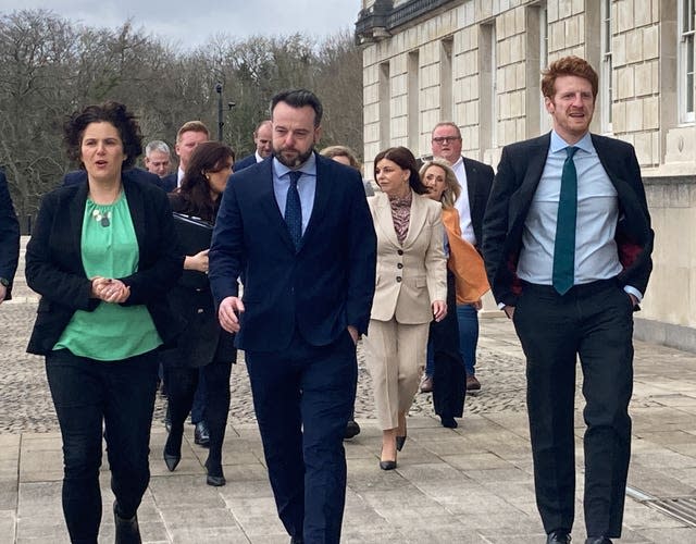 SDLP leader Colum Eastwood (centre), with South Belfast candidate Claire Hanna (left), and Opposition leader Matthew O’Toole at Stormont 