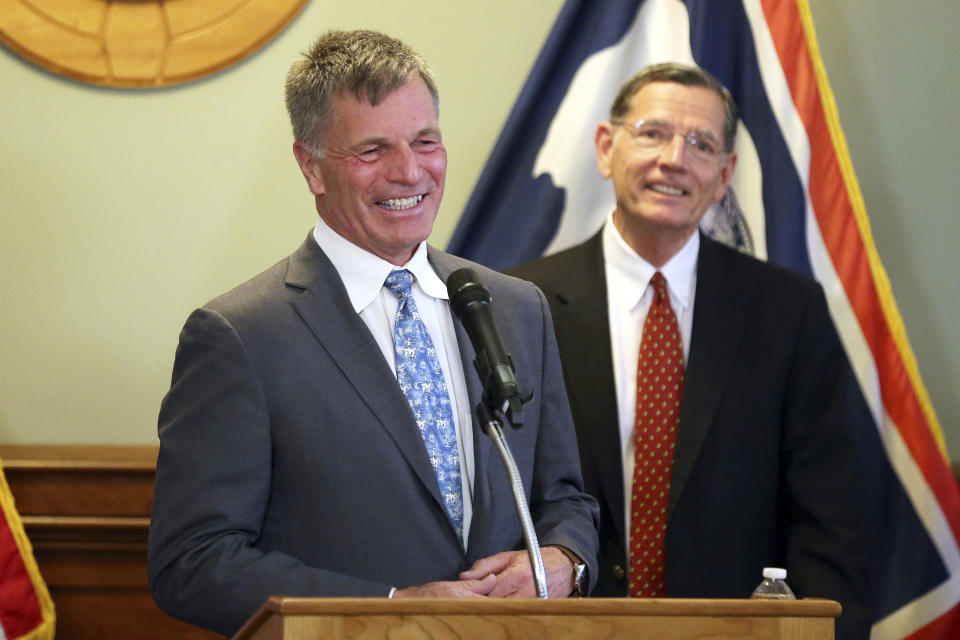 Wyoming Gov. Mark Gordon, left, shares a smile with U.S. John Barrasso, R-Wyo., during the press conference, Wednesday, June 2, 2021, at the Wyoming Capitol in Cheyenne, Wyo., announcing efforts to advance a Natrium reactor demonstration project at a retiring coal plant. A next-generation, small nuclear plant will be built at a soon-to-be retired coal-fired power plant in Wyoming in the next several years, business and government officials said Wednesday. (Michael Cummo/The Wyoming Tribune Eagle via AP)