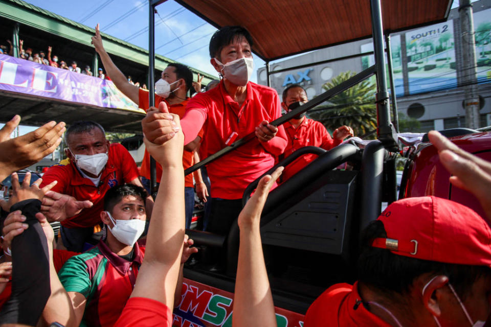Ferdinand "Bongbong" Marcos Jr., presidential candidate and son of the late dictator Ferdinand Marcos, greets supporters during a rally in Las Piñas City, suburban Manila, on March 13, 2022.<span class="copyright">Jam Sta Rosa—AFP/ Getty Images</span>