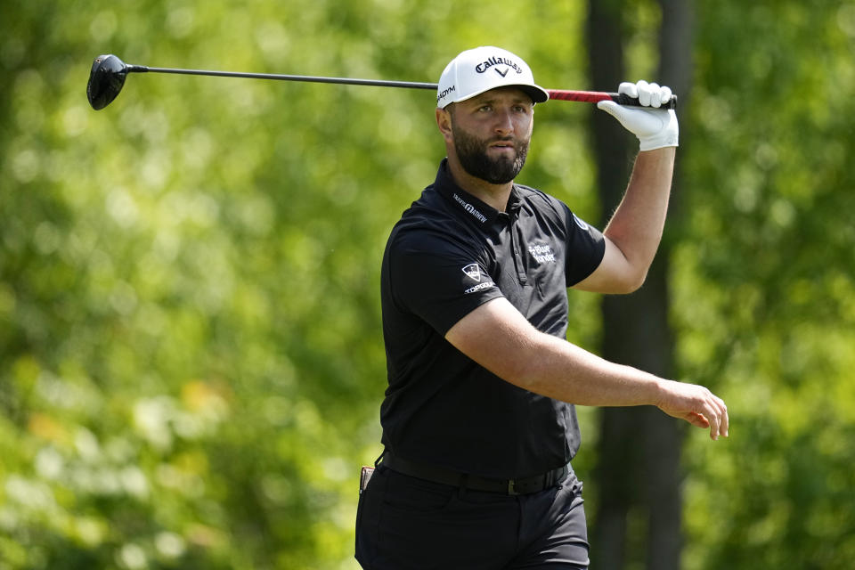 Jon Rahm, of Spain, watches his tee shot on the fourth hole during the first round of the PGA Championship golf tournament at Oak Hill Country Club on Thursday, May 18, 2023, in Pittsford, N.Y. (AP Photo/Abbie Parr)