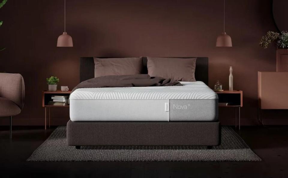 Saatva vs Casper image shows the Casper Nova Hybrid Mattress on a brown bed base in a brown bedroom dressed with brown furnishings