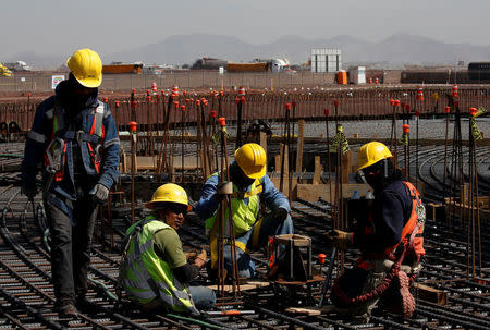 Employees work on the control tower foundations at the construction site of the new Mexico City International Airport in Texcoco, on the outskirts of Mexico City, Mexico February 1, 2018. Picture taken February 1, 2018. REUTERS/Carlos Jasso