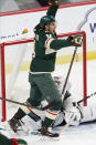 Minnesota Wild's Joel Eriksson Ek, left, celebrates his goal off San Jose goalie Devan Dubnyk during the first period of an NHL hockey game Friday, Jan. 22, 2021, in St. Paul, Minn. (AP Photo/Jim Mone)