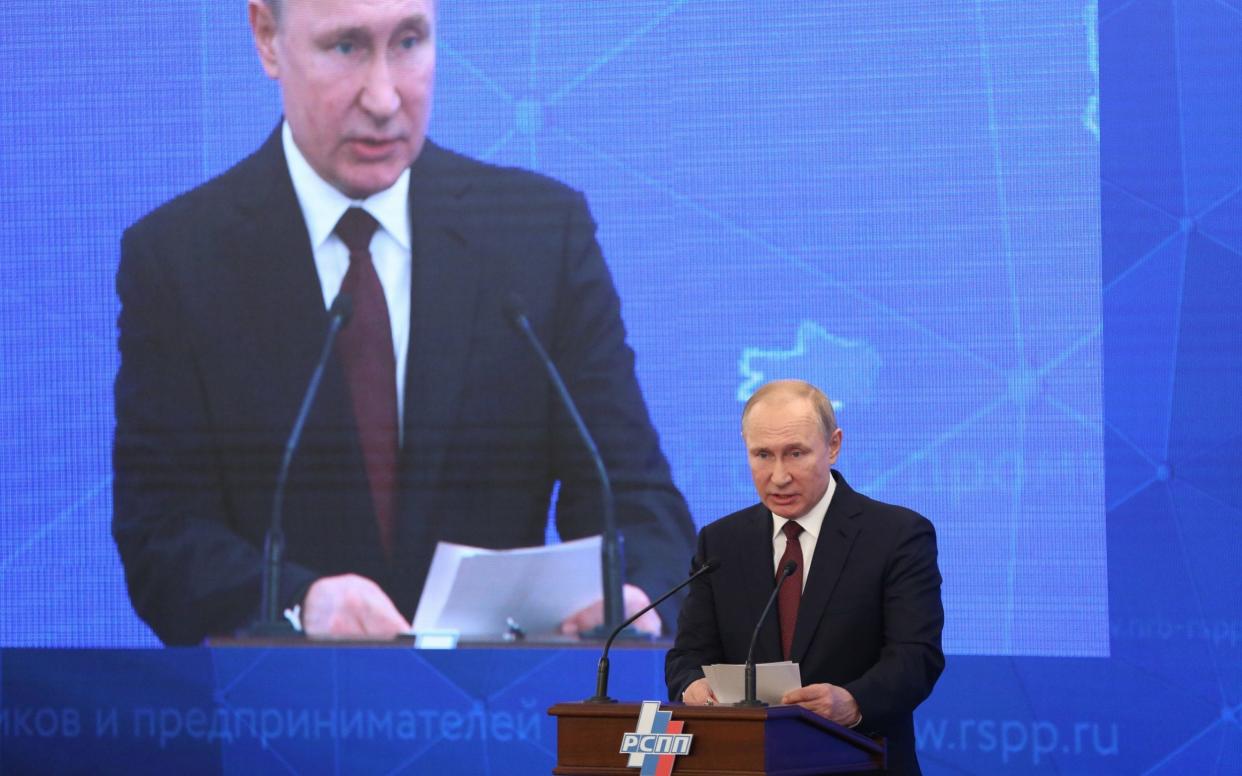 Vladimir Putin speaks at an industrial conference where he backed new legislation banning 'disrespect' of the state and 'fake news' - Bloomberg