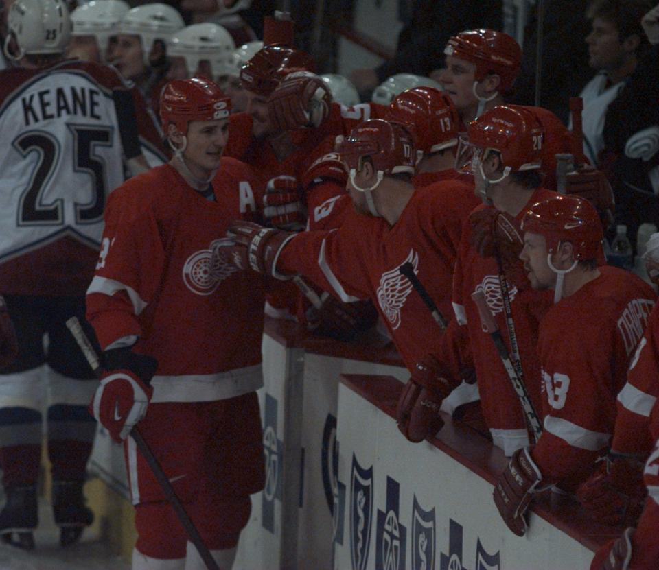 Detroit Red Wings' Sergei Fedorov, left, comes to the bench happy after the tying goal in the third period against the Colorado Avalanche during Game 2 of the Western Conference finals at McNichols Sports Arena in Denver, May 17, 1997.