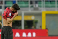 AC Milan's Olivier Giroud reacts after AC Milan's Malick Thiaw scores an own goal past his goalkeeper during a Serie A soccer match between AC Milan and Genoa, at the San Siro stadium in Milan, Italy, Sunday, May 5, 2024. (AP Photo/Luca Bruno)