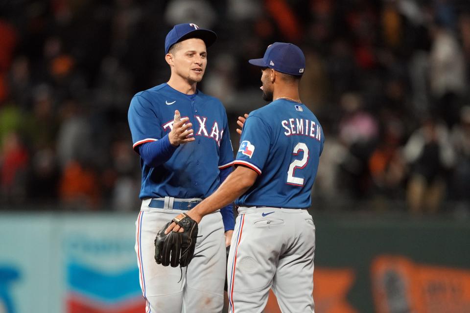 Corey Seager and Marcus Semien celebrate a win in San Francisco.