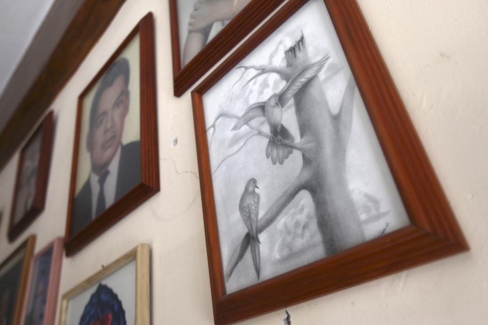 A drawing by Edgar Tamayo while he was in a Texas jail is hung on a wall inside the Tamayo family house in Micatlan