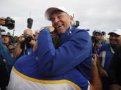 Golf - 2018 Ryder Cup at Le Golf National - Guyancourt, France - September 30, 2018 - Team Europe captain Thomas Bjorn celebrates with Francesco Molinari after winning the Ryder Cup REUTERS/Carl Recine